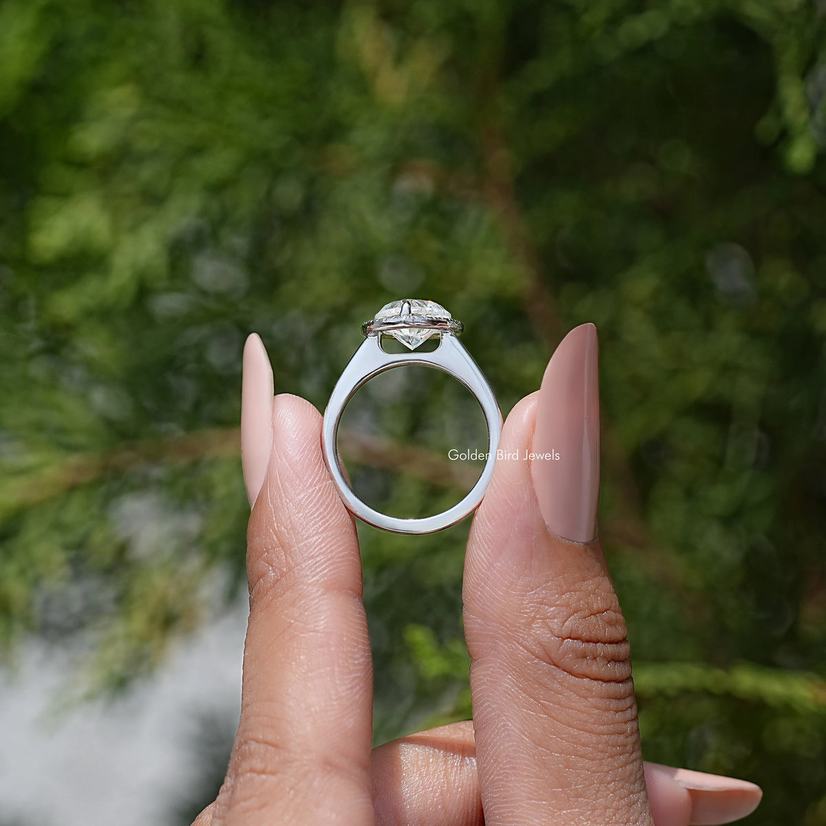 Heart-cut moissanite halo ring angled view showing heart center stone and slim band