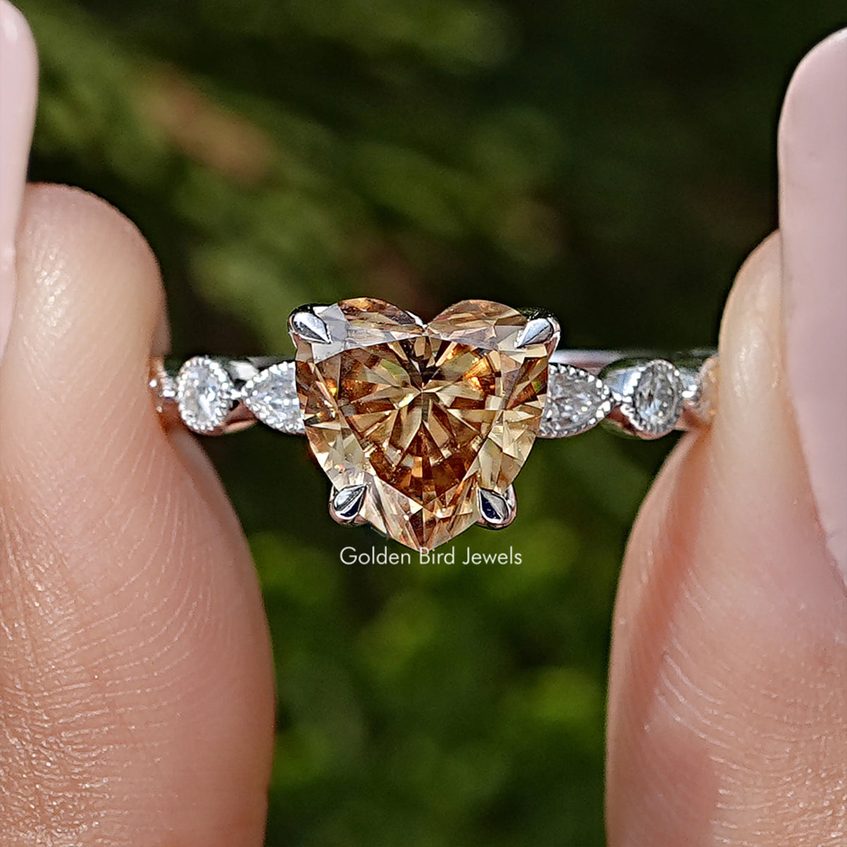 Sterling silver heart-shaped moissanite wedding ring with round stone accents on sides