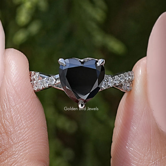 Black heart moissanite ring with twisted silver accent band