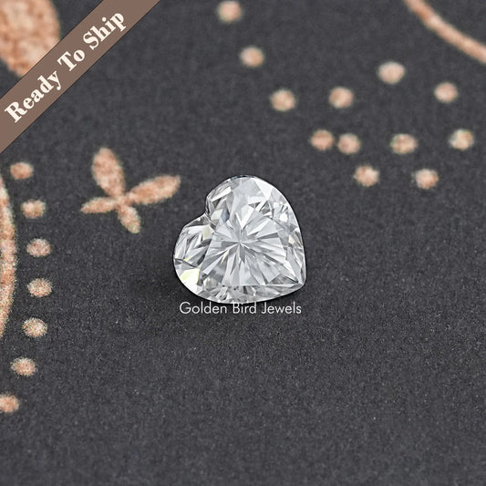 Heart-cut moissanite loose stone, angled view showing faceted heart sparkle