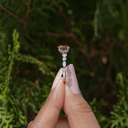 Side view of heart-shaped moissanite wedding ring with prong-set center stone