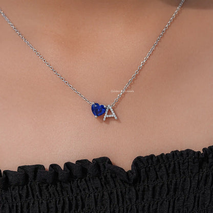 Blue heart gemstone and letter A initial pendant on a thin silver chain
