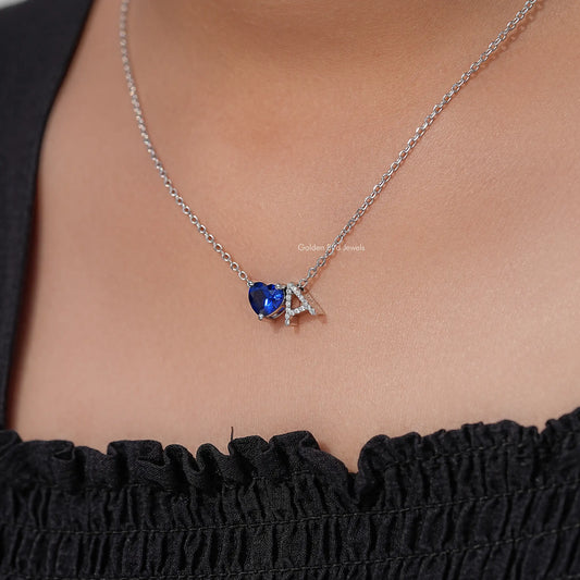 Heart pendant necklace with blue sapphire-like stone and letter A charm, silver chain
