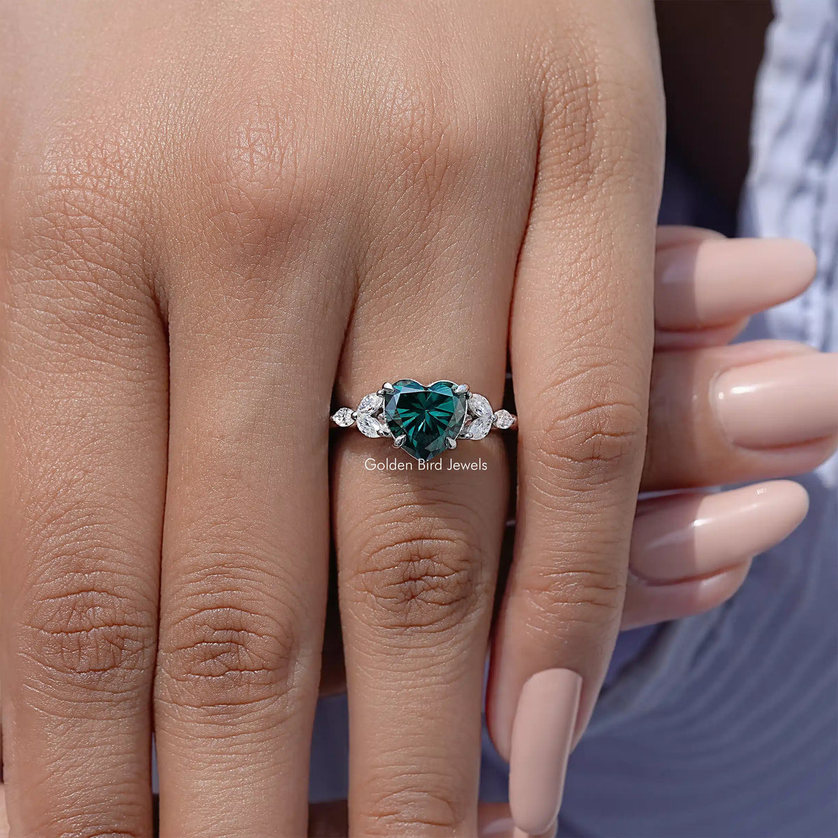925 sterling silver ring with green moissanite center and small side stones