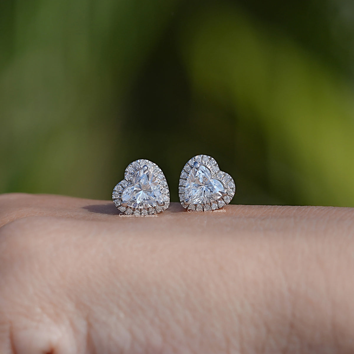In Hand Showing View Of heart Cut Diamond Stud Earring   