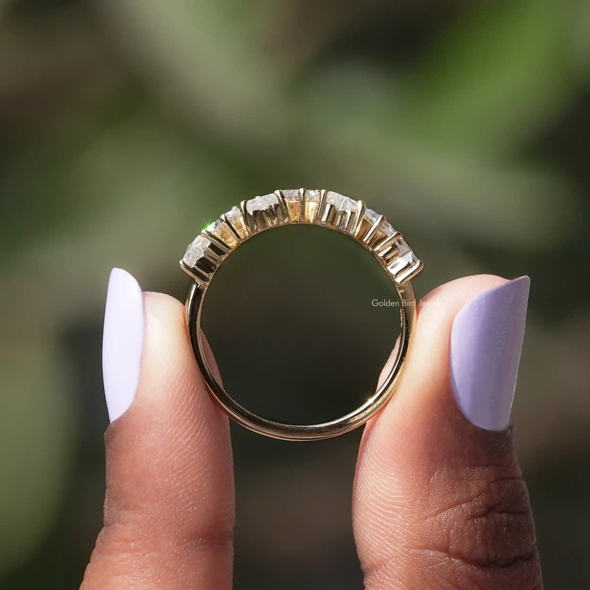 Half eternity wedding ring with small square moissanite stones along the band