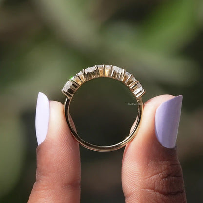 Half eternity wedding ring with small square moissanite stones along the band