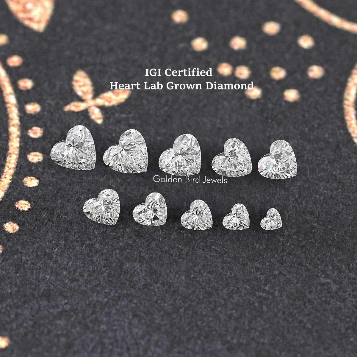Assorted loose heart-shaped lab diamonds in two rows, faceted sparkle