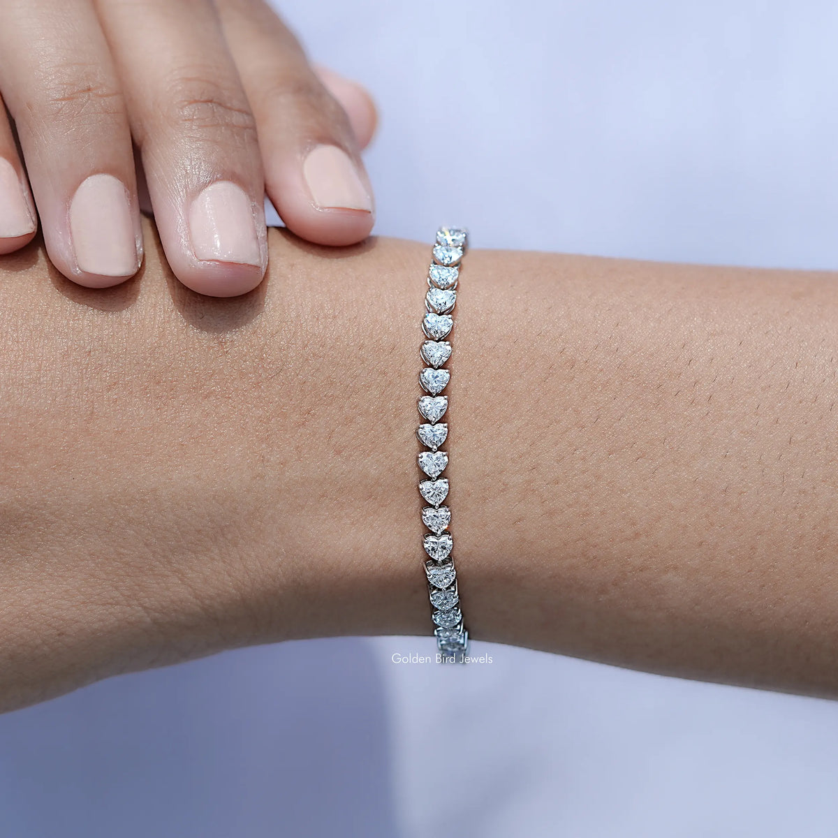 In hand Showing View Heart Cut Lab Tennis Bracelet
