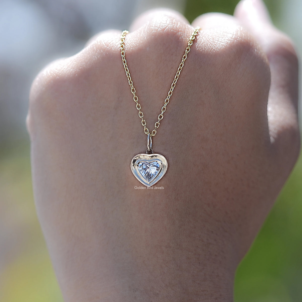 In Hand Showing of Heart Shaped Lab Diamond Solitaire Necklace