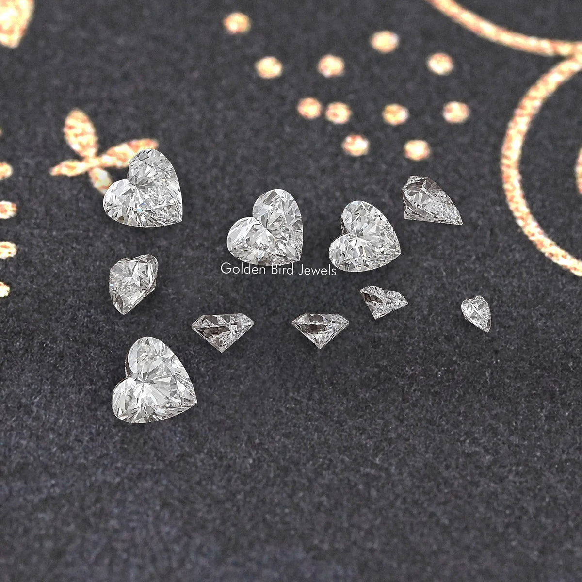 Loose lab-grown heart diamond stones, assorted sizes on display felt