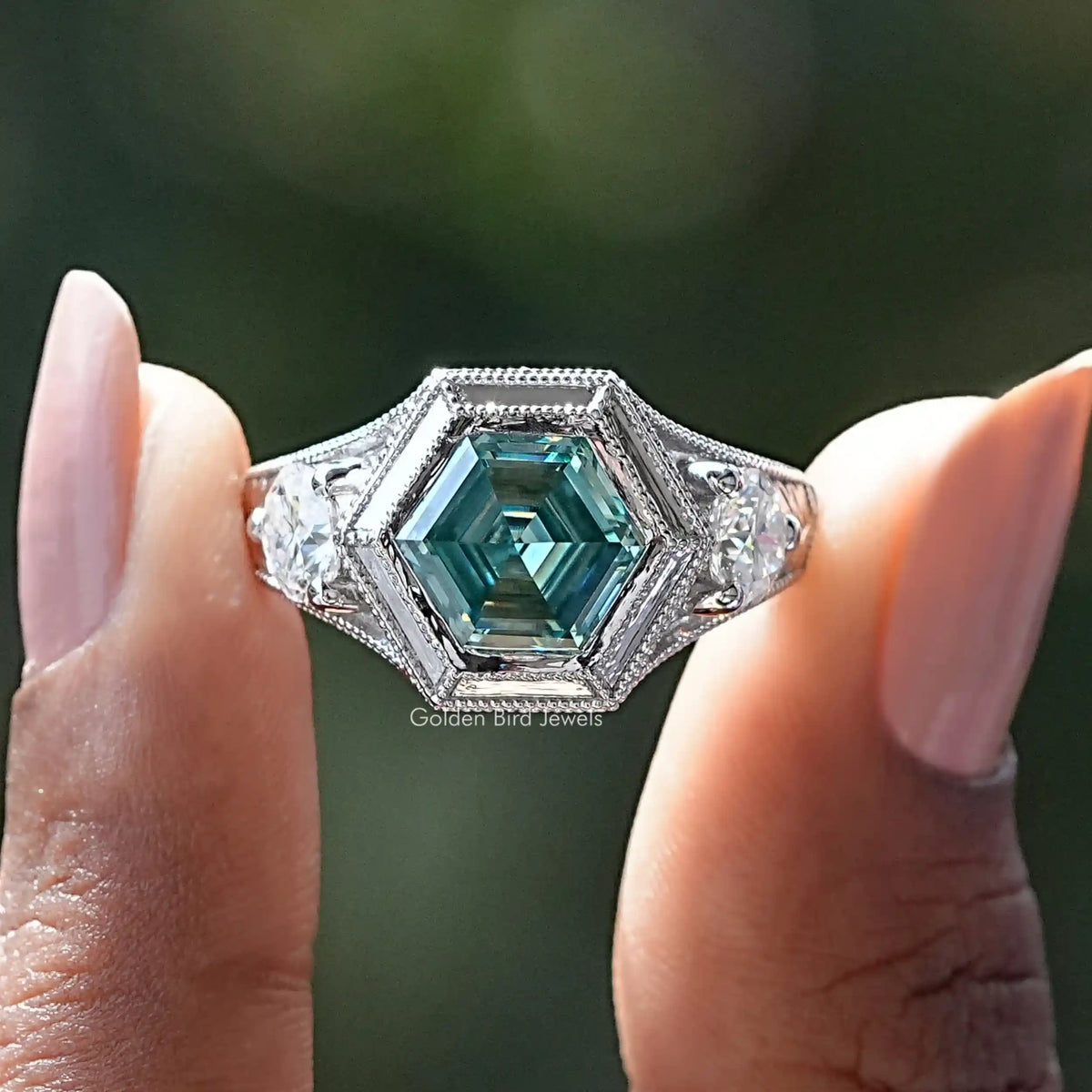 925 sterling silver ring with teal emerald-cut hexagon center moissanite and side stones