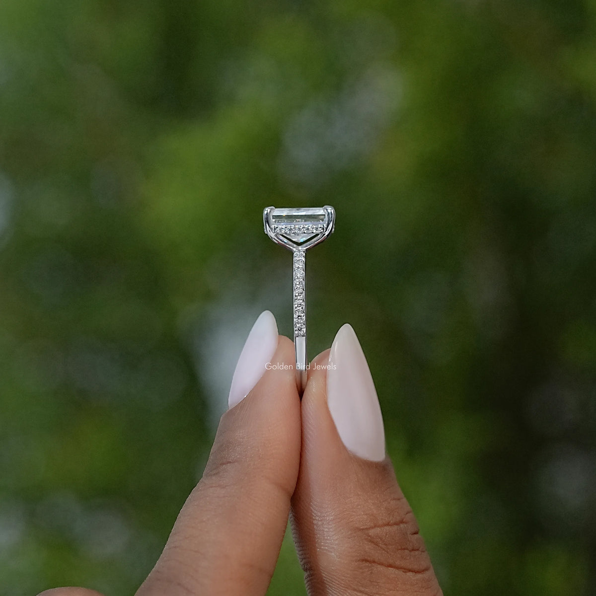 Prong setting close-up for radiant cut square moissanite solitaire ring on silver band