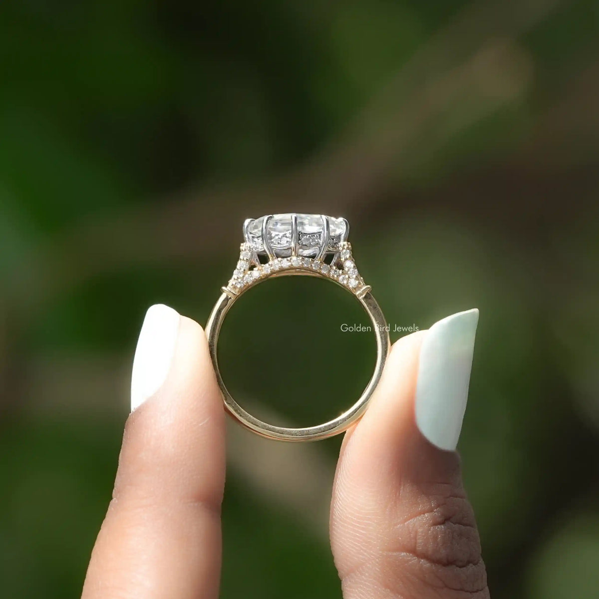 Back View of Marquise Cut Moissanite Ring In two fingers