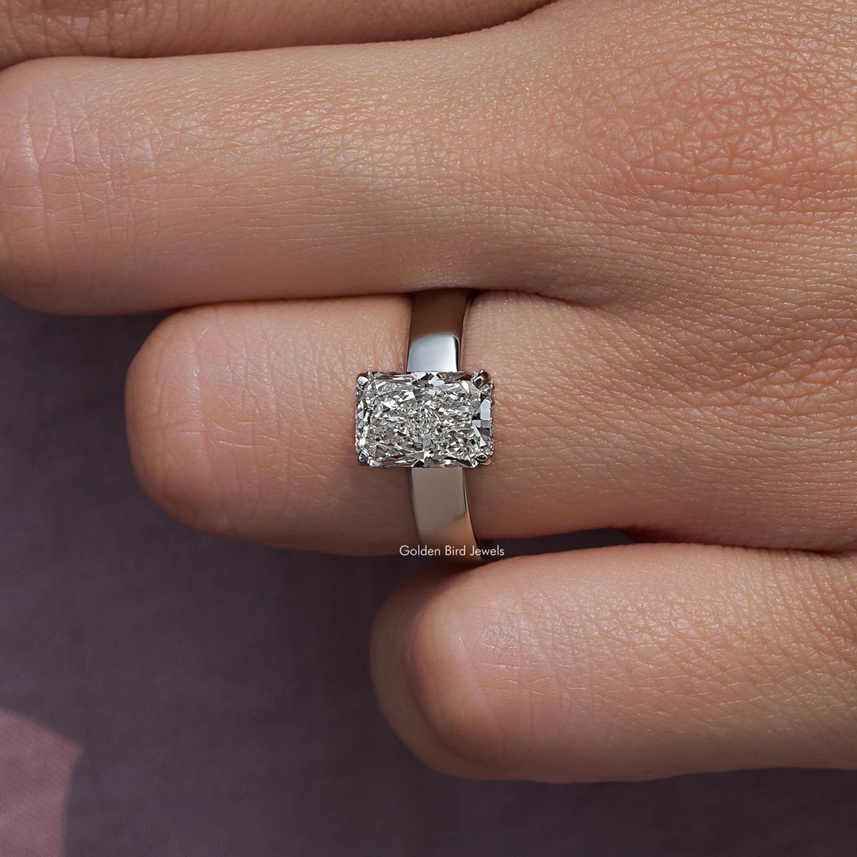 Close-up of a square-cut diamond on a silver ring band