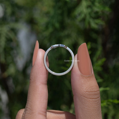 Moissanite ring profile with open top setting and round-cut stones, slim silver band