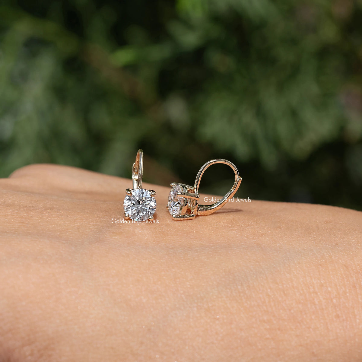 Gold-tone round lab-grown diamond dangle drop earrings, side view