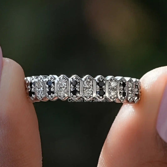 Round cut gemstone half eternity band with alternating clear and dark stones