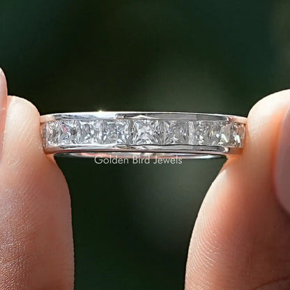 Sterling silver channel-set moissanite band with clear princess-cut stones across top