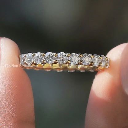 Silver-tone eternity band ring with round-cut clear stones across the full band