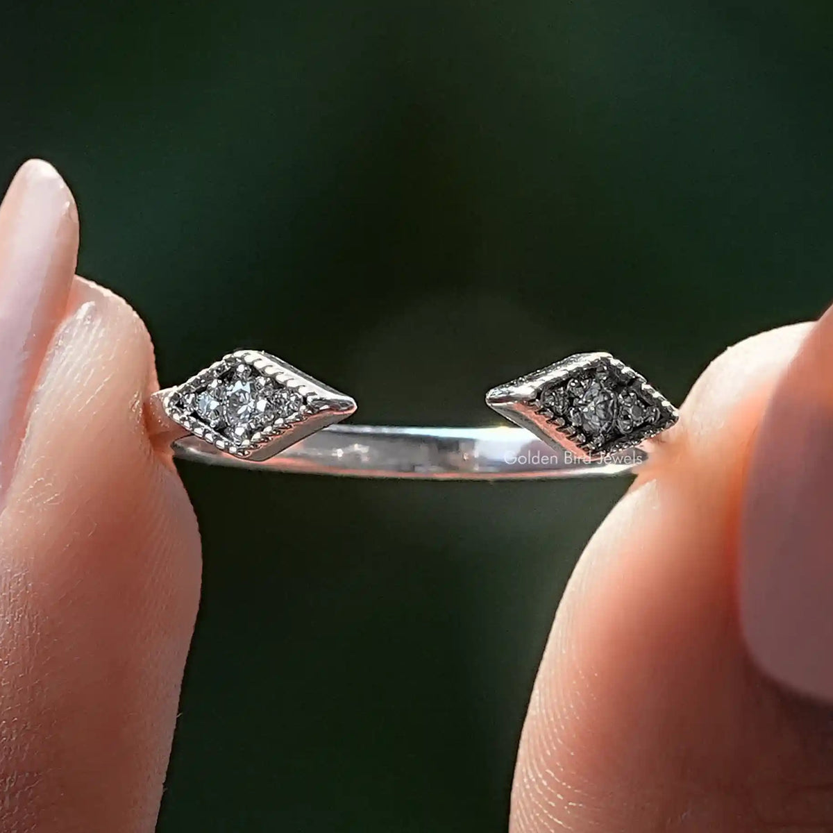 Open cuff wedding band with round moissanite stones and milgrain detail