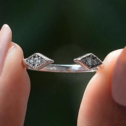 Open cuff wedding band with round moissanite stones and milgrain detail
