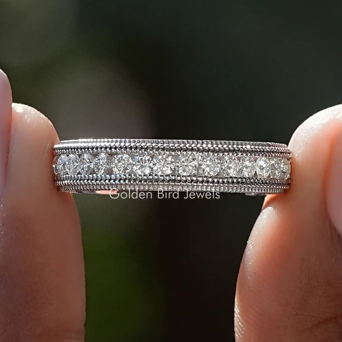 Round moissanite channel set ring band with milgrain edging, silver-tone metal