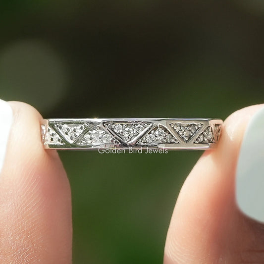 Silver-tone eternity wedding band with round moissanite stones in a full row
