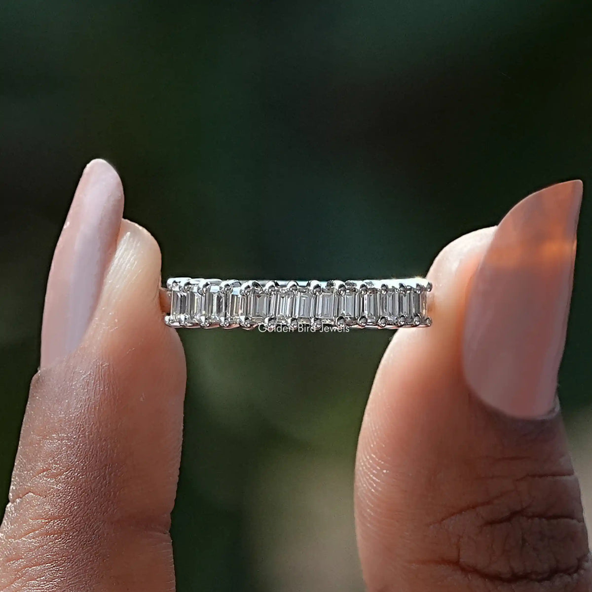 Silver half eternity ring with baguette-cut moissanite stones