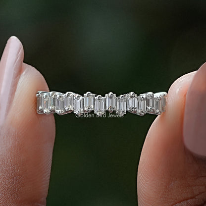 Silver half eternity band with baguette-cut stones along the top half
