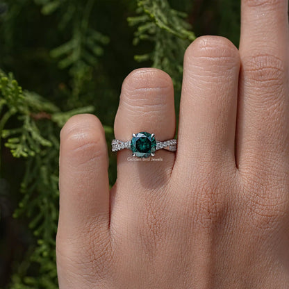 Green round moissanite ring with twisted pavé accent band