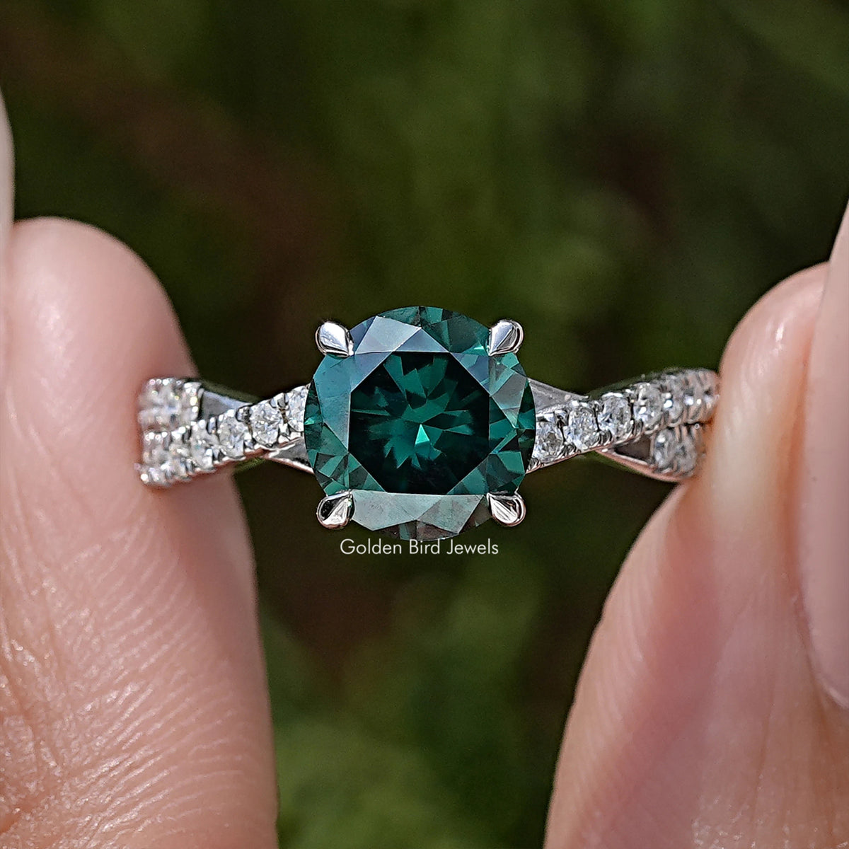 Green round moissanite ring with twisted pavé band