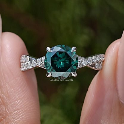 Green round moissanite ring with twisted pavé band