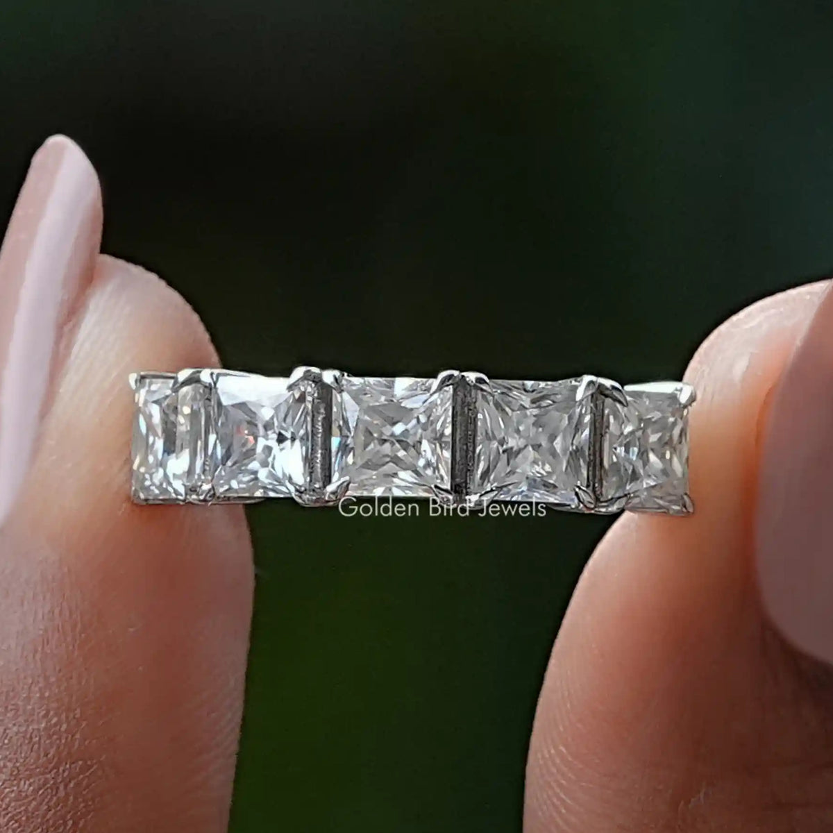 Silver half-eternity princess-cut moissanite band with five-prong square stones