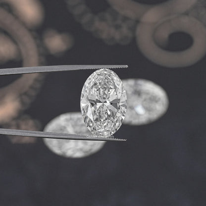 Oval-cut lab-grown diamond held between metal tweezers, clear sparkle