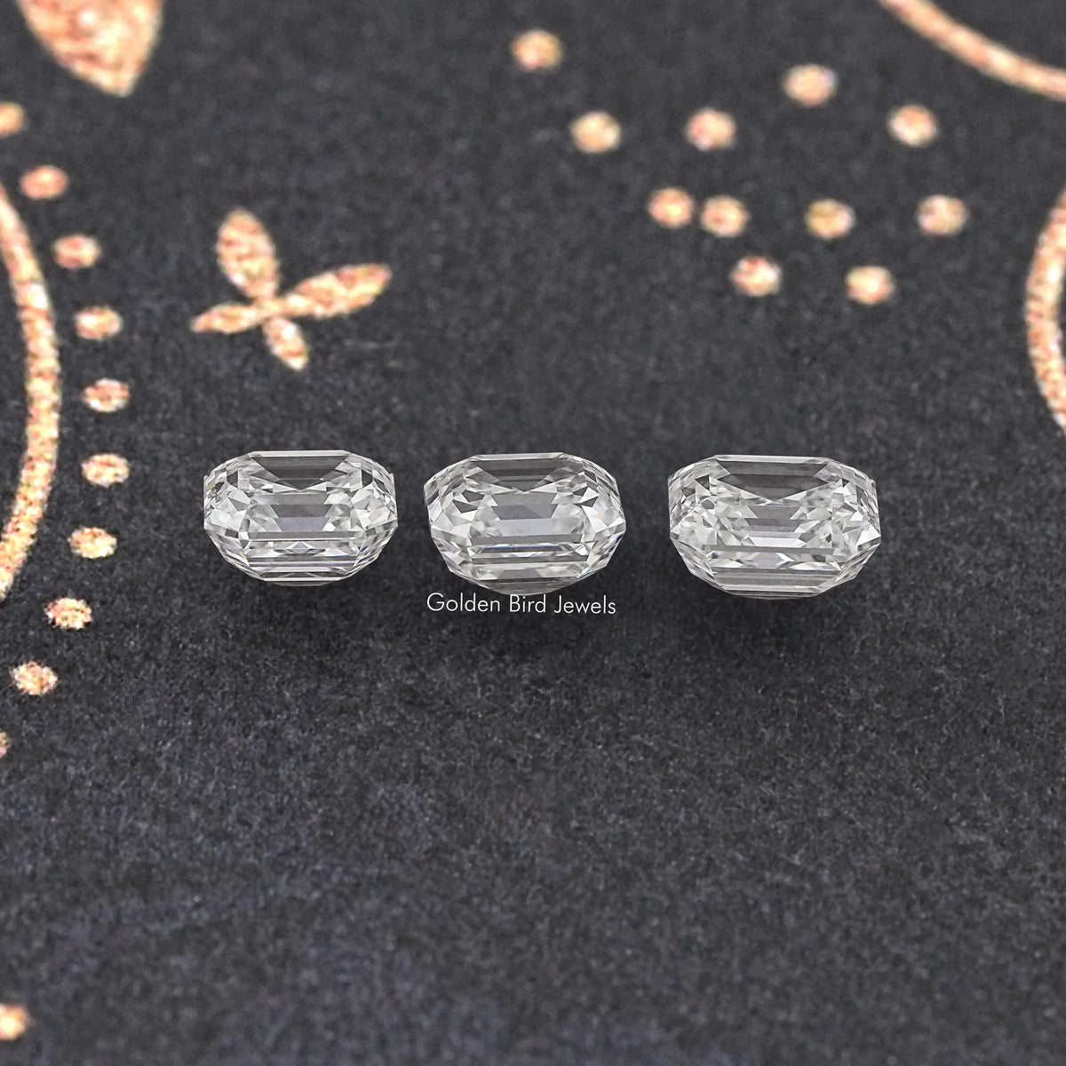 Asscher-cut lab-grown diamond set of three, clear stones on dark display