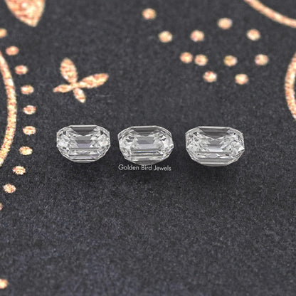 Asscher-cut lab-grown diamond set of three, clear stones on dark display