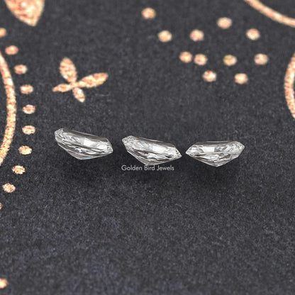 Loose radiant-cut lab diamond set of three, clear white stones on dark display