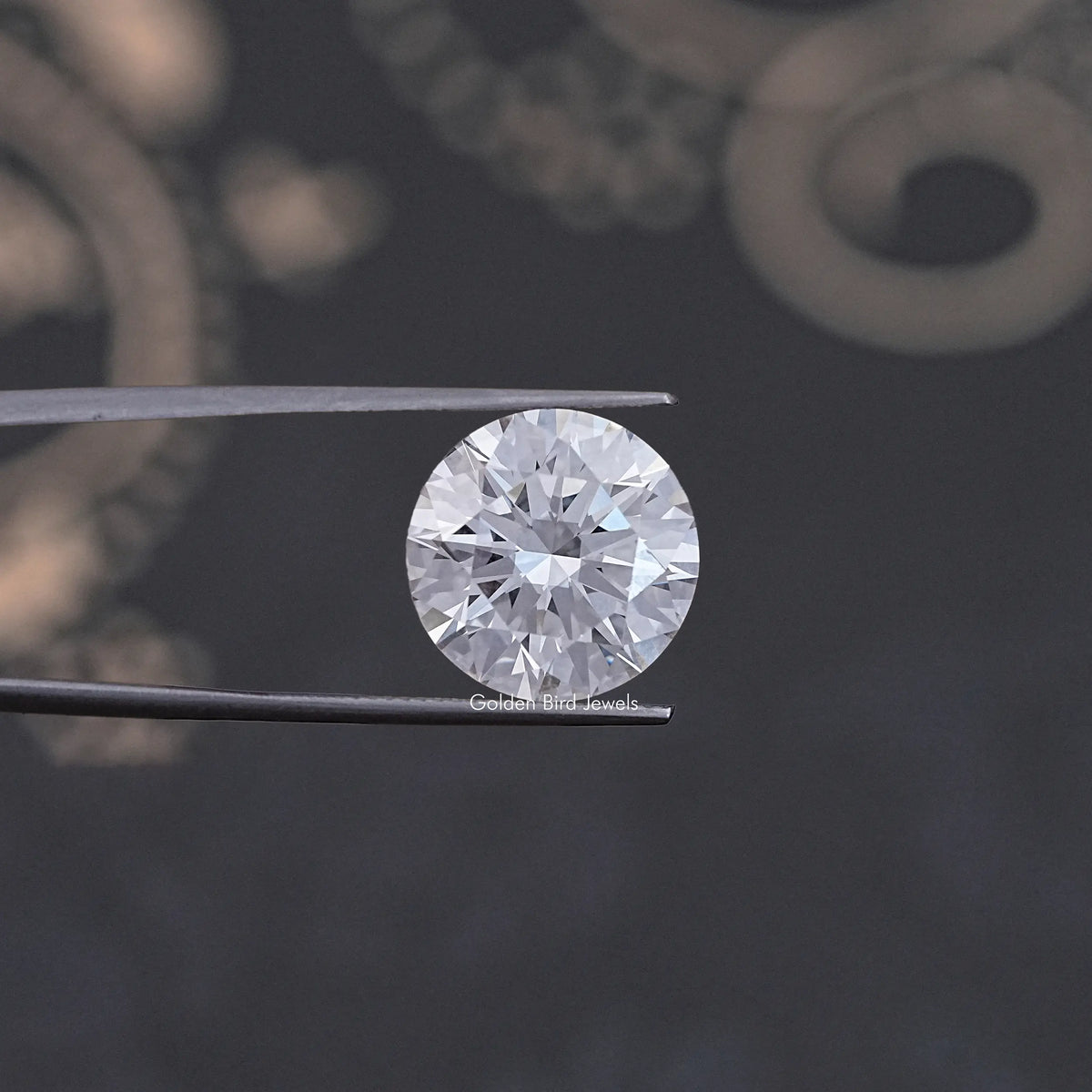 Single round-cut lab-grown diamond in tweezers, faceted white brilliance