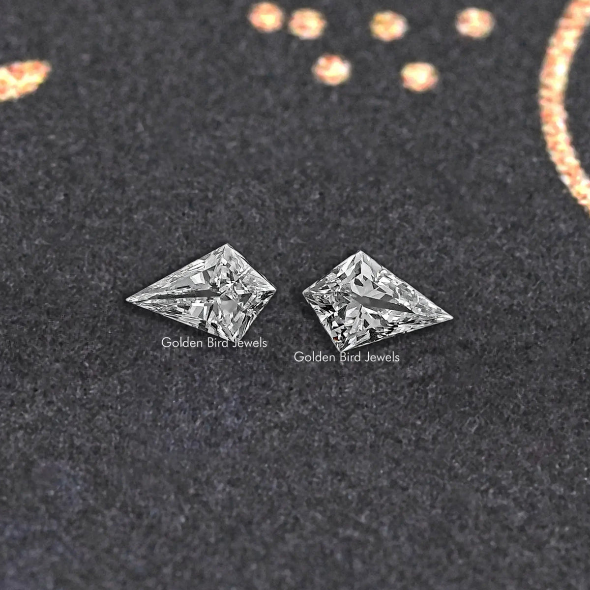 Pair of kite-cut lab-grown diamonds, loose stones on dark display
