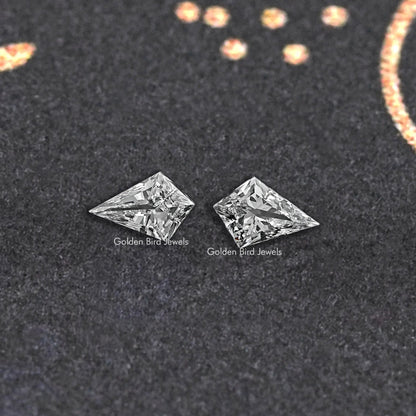 Pair of kite-cut lab-grown diamonds, loose stones on dark display