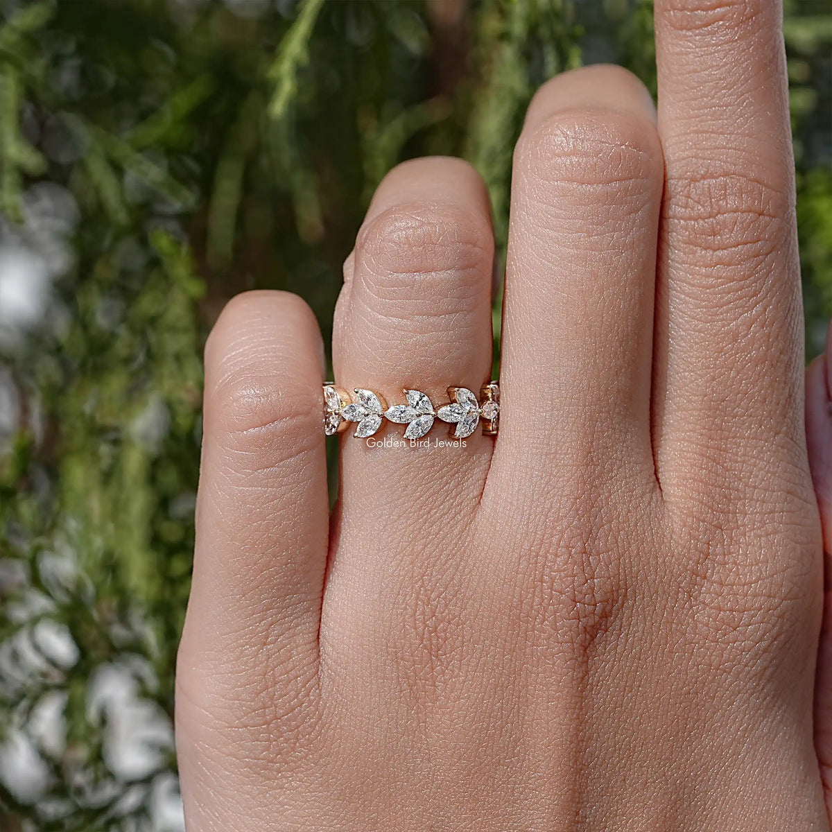 Dainty lab diamond wedding band with marquise stones, gold-tone band on hand