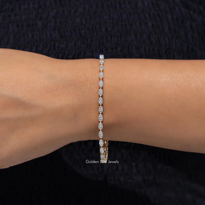 Lab-grown diamond tennis bracelet with marquise-cut stones, wrist shot with arm extended