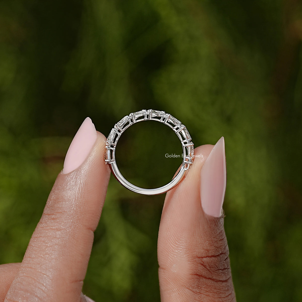 Pear-cut diamond eternity ring in silver, full circle of prong-set stones
