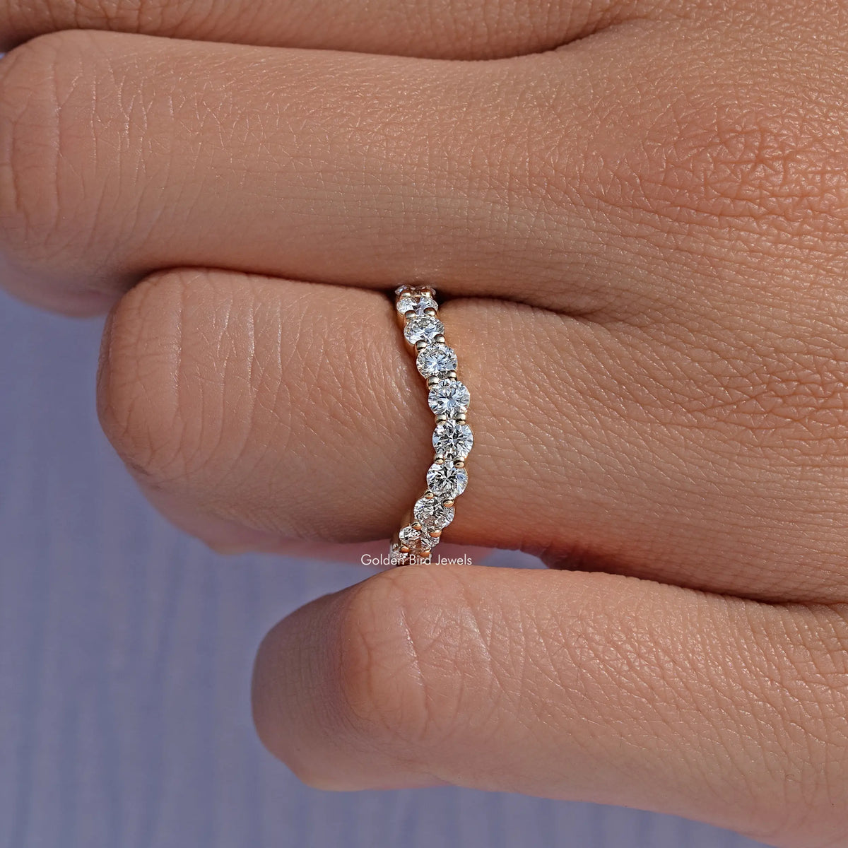 Silver-toned eternity wedding band with vertical row of round-cut lab diamonds