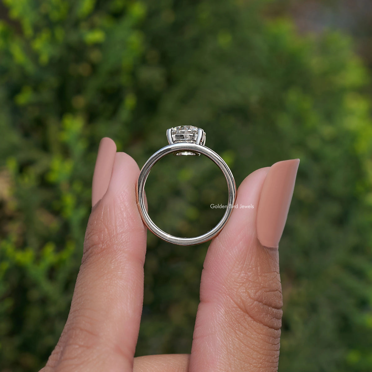 Silver curved solitaire ring with round lab diamond center, four-prong setting