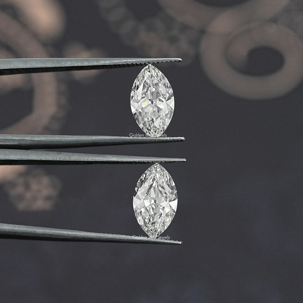 Two marquise-cut lab-grown diamonds held in metal prongs