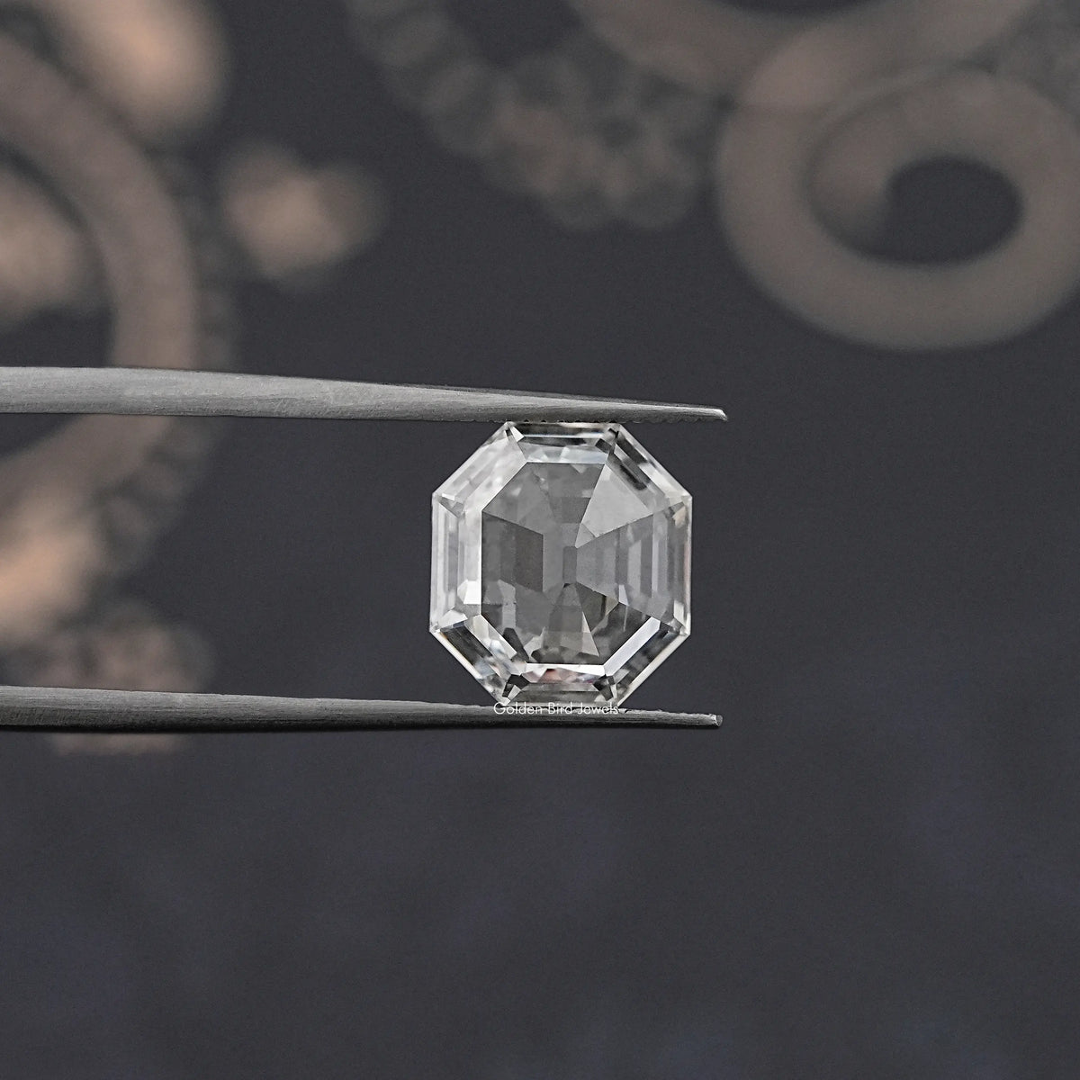 Lab-grown diamond old mine hexagon cut, close-up held by tweezers
