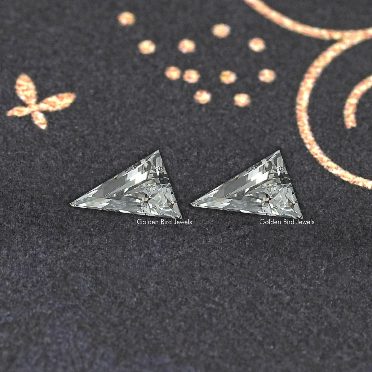 Long triangle lab-cut diamond studs, front view of two faceted triangle stones