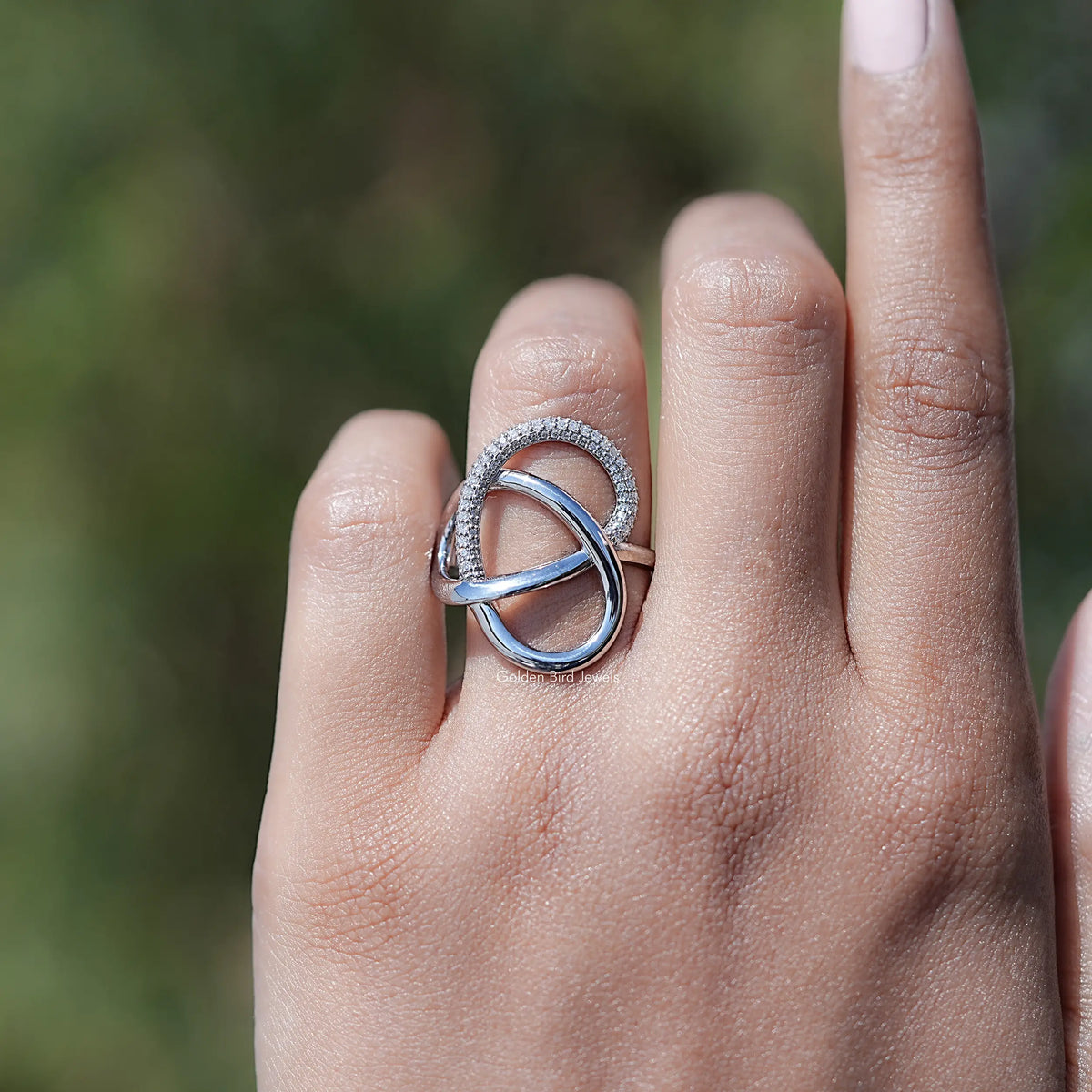 Sterling silver crisscross loop ring with round lab diamond halo and open center loop